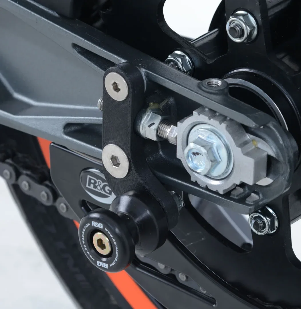 R&G Комплект ролки/адаптори за задна стойка (изнесени) за KTM 125 Duke (2017–2023), RC 390 (2017–2021), 200 Duke (2017–2022), RC 125 (2017–2021)
