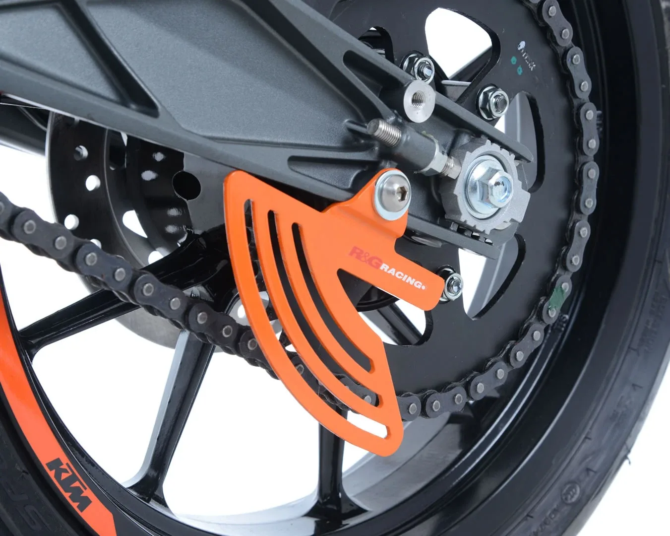 R&G Предпазител за верига „акулска перка“ за KTM RC 125 (2014+), RC 200 (2014–2022), RC 390 (2014+) и др.