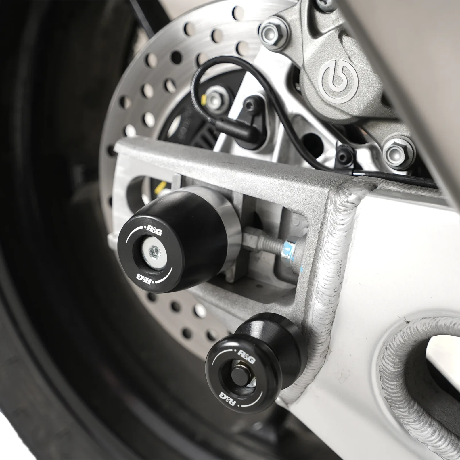 R&G Протектори за шарнир APEX за Aprilia Tuono V4 1100 RR (2025+), Tuono V4 1100 Factory (2025+)